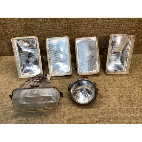 93 - Three pairs of Vintage car headlights including Lucas and a set of Capri lamps.