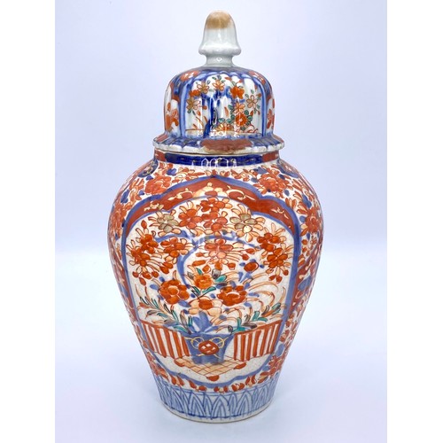 663 - Antique Imari / Arita ware lidded urn Chinese and hand painted. 28cm tall.