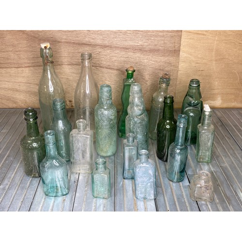 107 - Collection of vintage glass bottles mostly Welsh.
