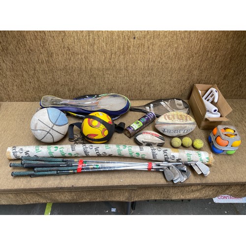 112 - Collection of sporting equipment including tennis rackets, golf clubs, foot balls and rugby ball.