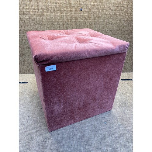 174 - Salmon upholstered storage pouffe.