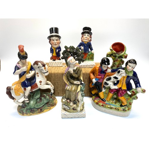 492 - Collection of Staffordshire pottery figures and candle holder.