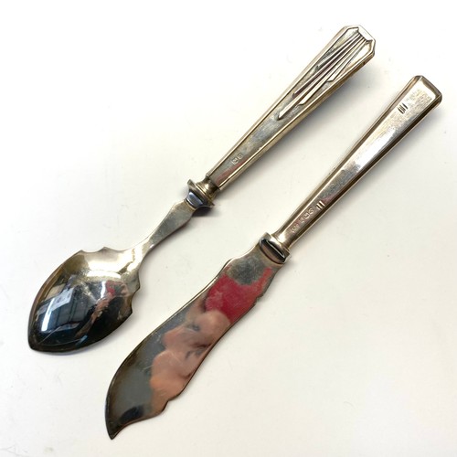 879 - Silver fish knife and oyster spoon both hallmarked Sheffield.