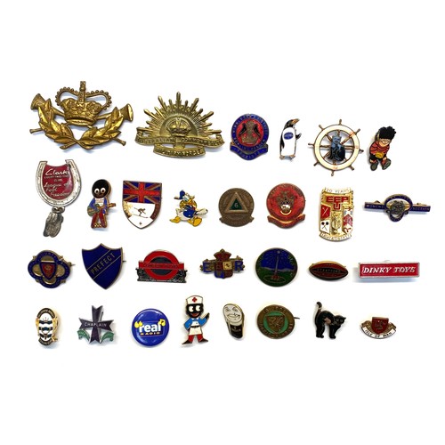 671 - Collection of 30 enamel badges cap badges and rank badges, including , Guinness golly and dinky toys... 