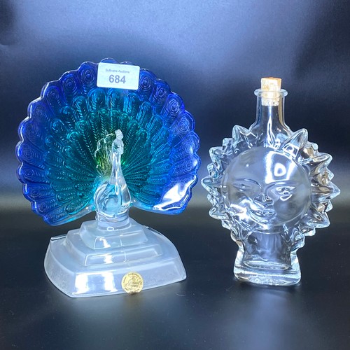 684 - Three glass and crystal perfume/atomiser bottles and a stained glass Peacock.