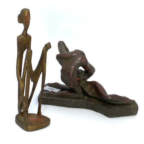 687 - A bronzed sculpture of man 20cm tall and a sculpture of a couple in an embrace signed WM. L Greene 2... 