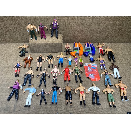 520 - Large quantity of WWE Wrestling figures and two Nerf Guns.