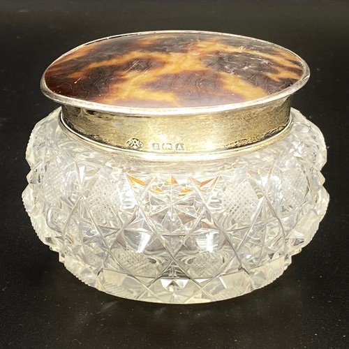 905 - Crystal trinket box with a hallmarked silver and tortoise shell lid.