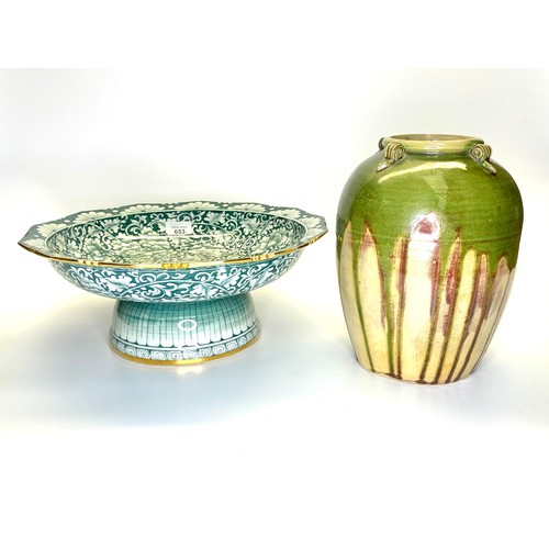 653 - A hand painted Thai ceramic fruit bowl with a rich green glazed finish and a hand-painted earthenwar... 