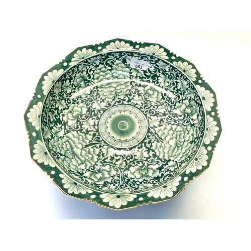 653 - A hand painted Thai ceramic fruit bowl with a rich green glazed finish and a hand-painted earthenwar... 