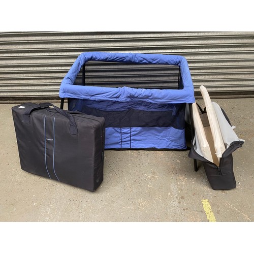 18 - Two Babybjorn travel cots.