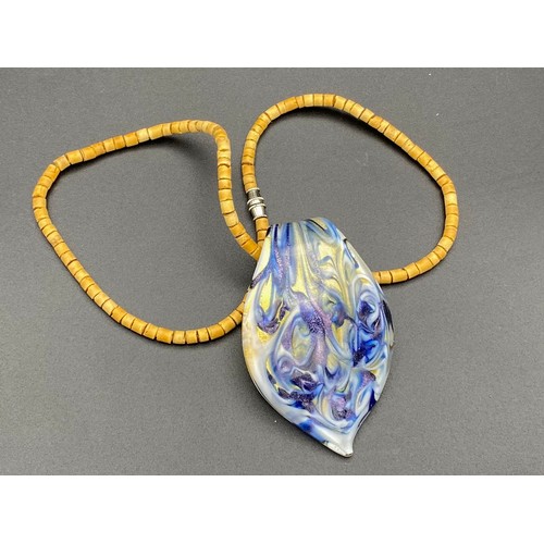 661 - Murano glass pendant on a cork beaded necklace.