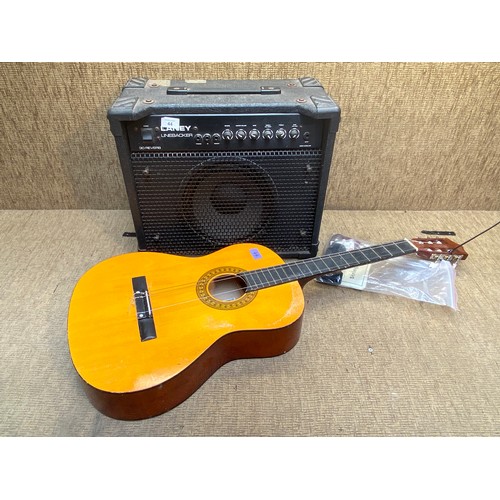 44 - A Herald Acoustic Guitar model number HL44 and a Laney Line-backer guitar amplifier.