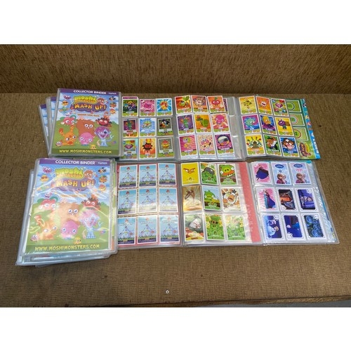 1098 - 14 full Topps Moshi Monsters albums with over 1200 cards in them.