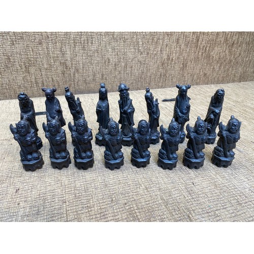 478 - Large wooden Chinese themed chess pieces.