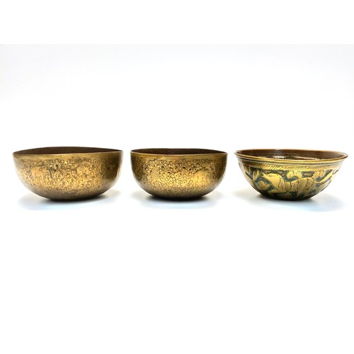 675 - Three Indian etched brass bowls.