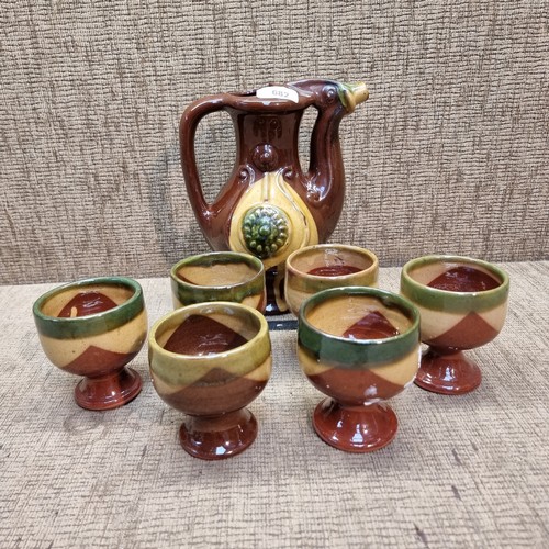 682 - Russian ceramic wine jug with six goblets