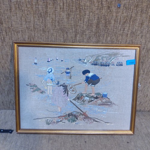 1191 - Framed hand made cross stitch picture of a sea side scene on a hessian backing.