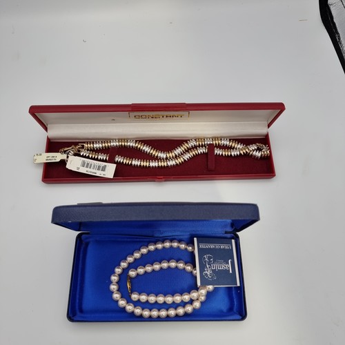 695 - Boxed Jasmine simulated pearls with COA and a vintage boxed Monnet necklace with original tag priced... 