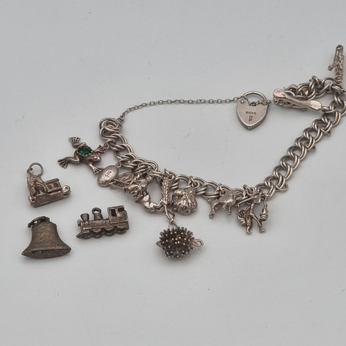 871 - Silver charm bracelet and 10 charms with 4 loose charms.