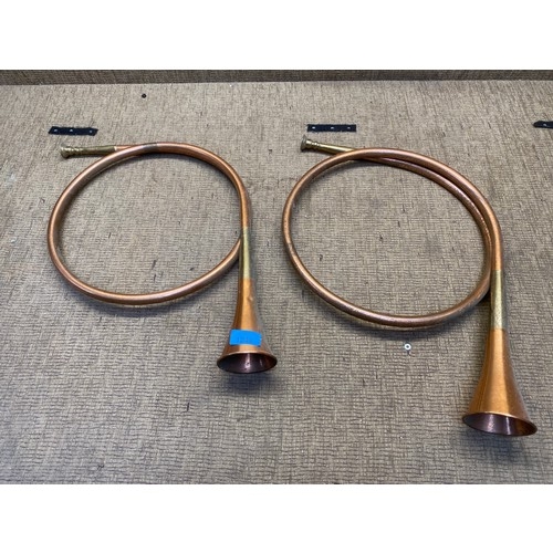 1249 - Pair of copper hunting horns.