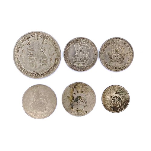 885 - 6 silver and half silver coins. Including a 1920 half crown and shillings.