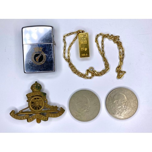 705 - HMS Ambuscade Zippo lighter, Royal Artillery cap badge, two Churchill coins and a replica gold ingot... 