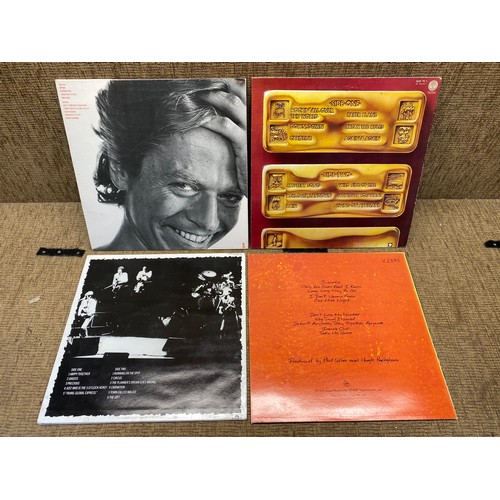 1123B - Four vinyl LP records including Robert Palmer, status quo, Phil Collins And The Jam.