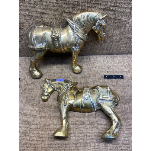 528 - Pair of very heavy solid brass door stops 35cm long.