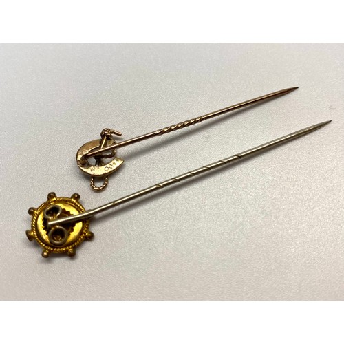 958 - 15ct rose gold Victorian stick pin and a 9ct gold horse shoe stick pin.