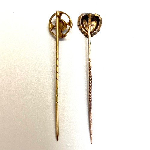 963 - Two 9ct gold stick pins with one in a Celtic style with pearl and garnet and one heart and flower.