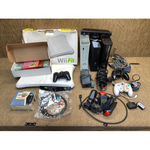 2 - Three Xbox 360 consoles with leads and controllers.