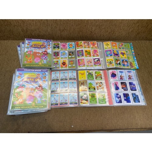 3 - 14 full Topps Moshi Monsters albums with over 1200 cards in them.