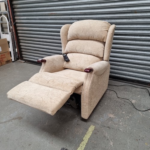 71 - Cream floral electric arm chair.
