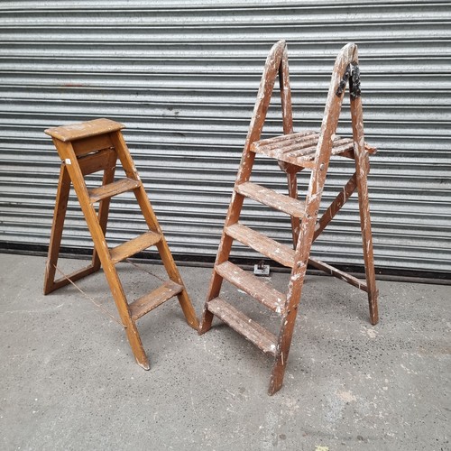 75 - two vintage wooden step ladders.