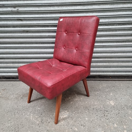 76 - Ox blood leather nursing chair.