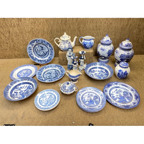 66 - Large quantity of Blue and White ceramics including Two Chinese Ginger jars and some Willow jugs.