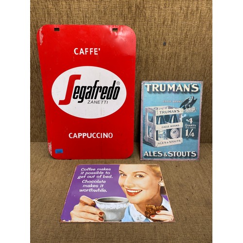 1044 - A Metal Segafredo Cappuccino advertising sign and two small advertising signs.