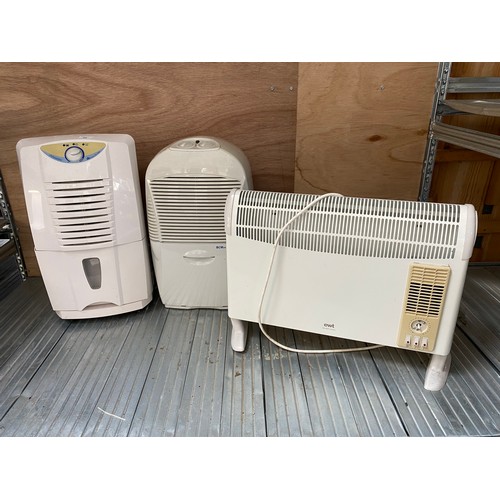 99 - Two dehumidifiers and an electric heater.