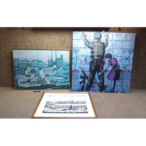 158 - two Lowry prints and a Banksy canvas.