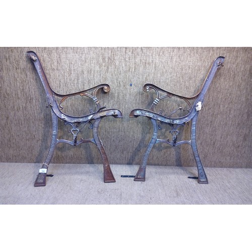 162 - Pair of wrought iron bench ends.