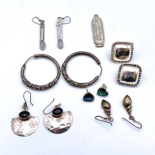849 - Silver earrings and lockets.