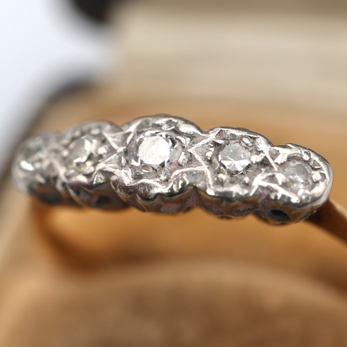 852 - 18ct gold and 5 diamond ring with a platinum mount. (largest diamond 2.5mm the 2 either side are 1.6... 