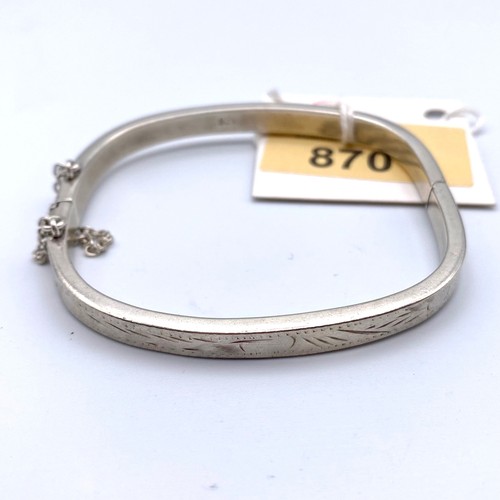 870 - Silver bangle, square shape with engraving and safety clasp.