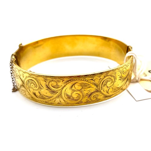 873 - 9ct Gold plated (20 microns) on silver fancy bangle. Total weight 42.3 grams.