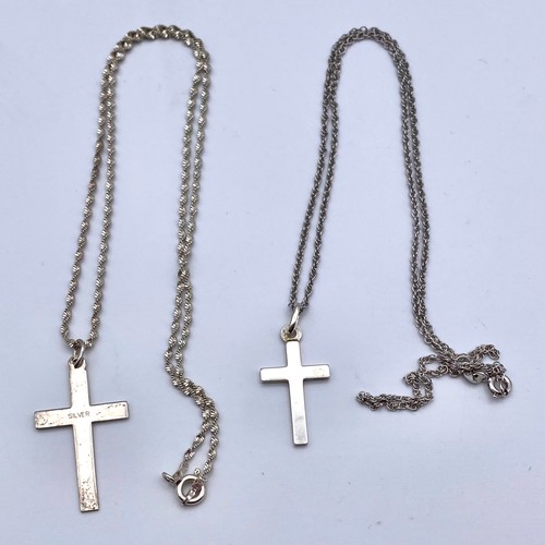 875 - Two silver cross and chains.