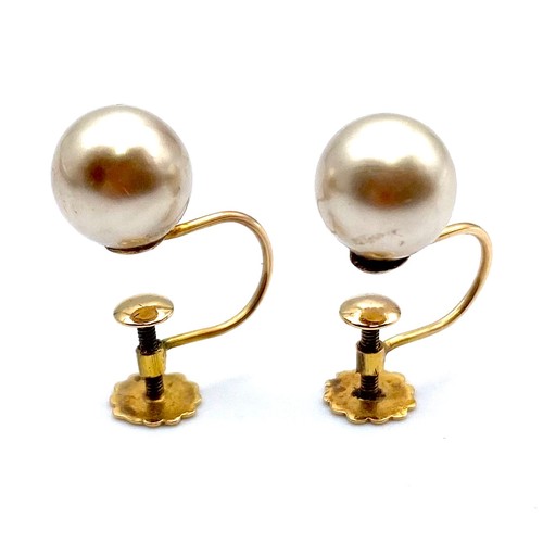 902 - Pair of 9ct gold and pearl screw back earrings, by Bravingtons Jewellers Kings Cross London, in thei... 