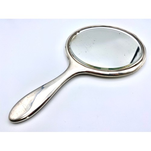 910 - Silver dressing table mirror with hallmarks.
