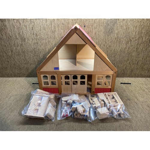780A - Vintage dolls house with dolls house furniture.