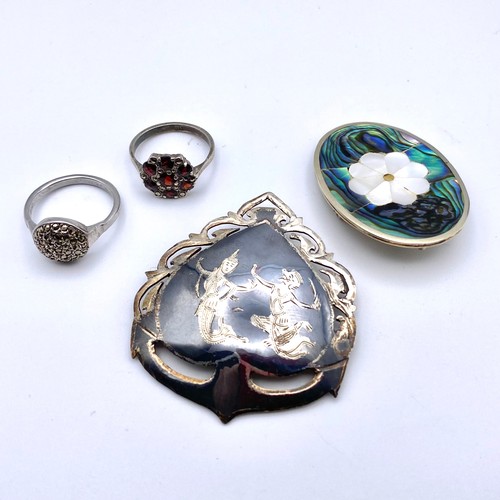 912 - Two silver brooches and two silver rings. Size L&M.